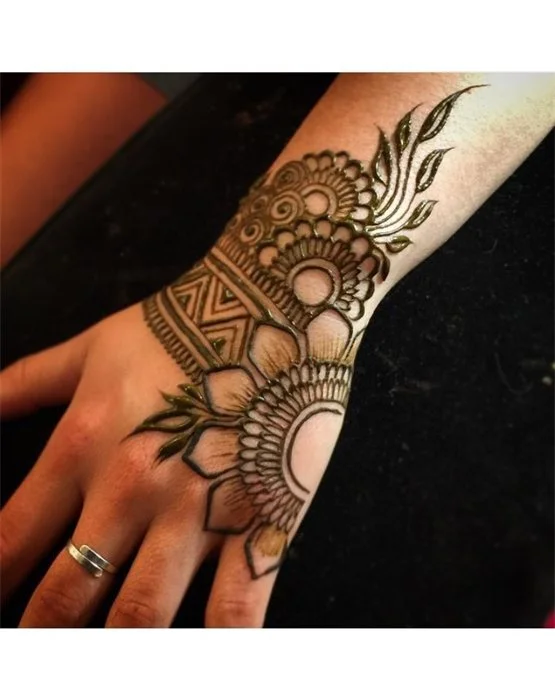 Intricate Vine And Drape Covering Back Hand Mehndi Design Intricate Vine And Drape Covering Back Hand Mehndi Design